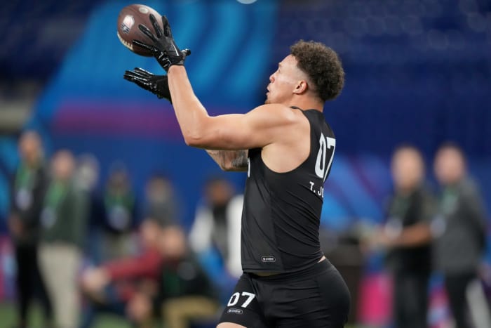 Mar 1, 2024; Indianapolis, IN, USA; Penn State tight end Theo Johnson (TE07) works out during the 2024 NFL Combine at Lucas Oil Stadium.
